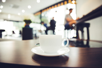 cup of coffee on table in cafe or restaurant