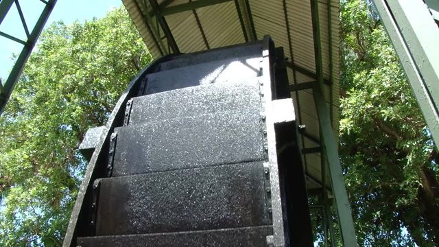 Close shot of old water wheel at Depaz distillery on Martinique island
