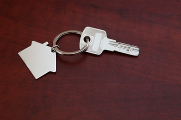 Key on wooden table close up