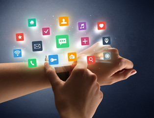 Naked female hand with smartwatch and  application labels around and dark background