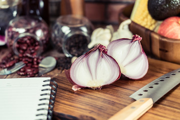 Onion placed on the wood floor in the kitchen.