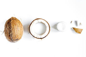organic cosmetics with coconut on white background top view