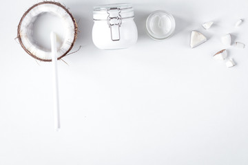 organic cosmetics with coconut on white background top view mock