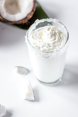 cocktail with coconut on white background