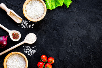 Obraz na płótnie Canvas ingredients for paella on dark background top view