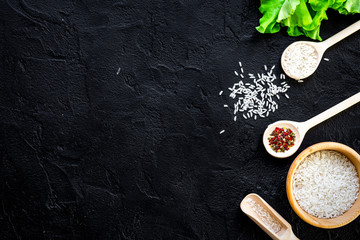 Fototapeta na wymiar ingredients for paella on dark background top view