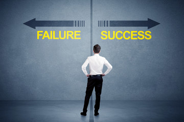 Fototapeta na wymiar Businessman standing in front of success and failure arrow concept on grungy background