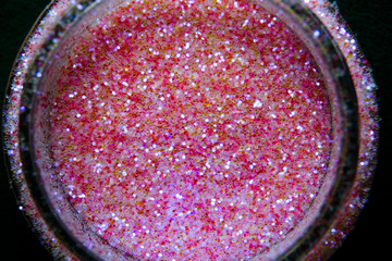 Multicolored shiny pearlescent dust close-up.