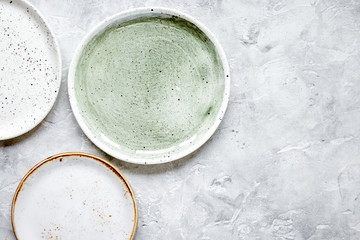 ceramic tableware top view on stone background mock up