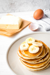 cooked pancake on plate at wooden background