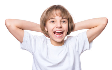 Attractive caucasian girl, isolated on white background. Schoolgirl smiling and looking at camera. Happy child in white t-shirt - emotional portrait close-up.