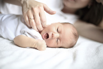 Fototapeta na wymiar serene newborn baby sleeps next to mom
