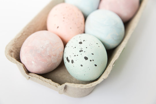 Easter eggs,painted light pastel colors in paper tray.Minimalistic stylish image.Easter  background.