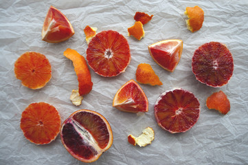 Pieces of blood orange on white background.