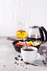 Fresh delicious breakfast with soft boiled egg, crispy toasts and cup coffee