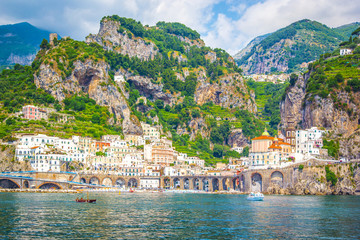 Fototapeta premium Panoramic view of Amalfi Mediterranean coast, small town with multicolor houses in south of Italy, Gulf of Salerno, Campania