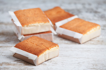 Sobaos pasiegos on an old wooden table