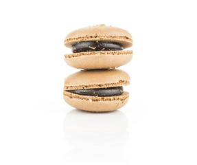 Two French macarons chocolate isolated on white background.