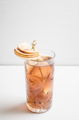 Cocktail with cola, apples and whiskey. Selctive focus.