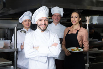 Chef in kitchen with staff
