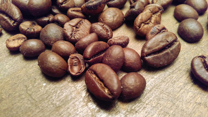 coffee beans on wooden table. detail