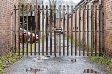 Rusty old gate and alley way