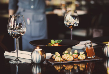 Romantic dinner at the restaurant. Pumpkin soup and snack is julienne. 