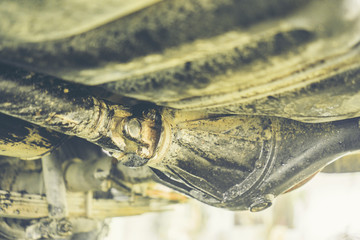 The car is dirty with asphalt oil.