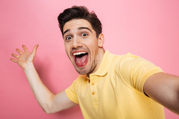 Portrait of a happy young man waving