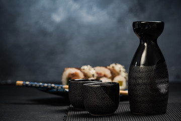 Drinking traditional sake and eating sushi