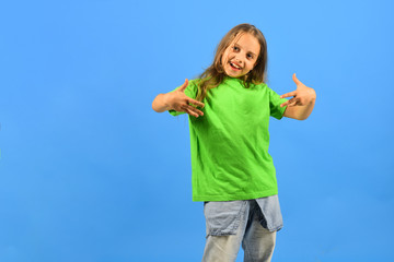 Girl with happy face on blue background, copy space