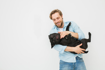 young man with dog isolated on white - obrazy, fototapety, plakaty