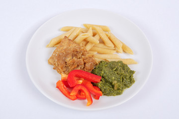 Tempeh with spinach and pasta on a white