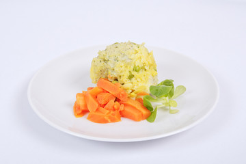 Rice with vegetables and herbs on a white