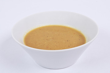 Parsley curry soup on a white