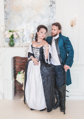 Beautiful couple woman and man in medieval clothes