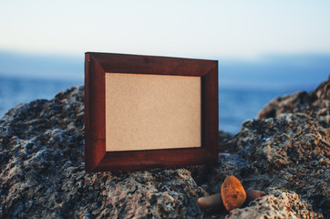 Photo frame stone, sea at sunset place for lettering, copyspace
