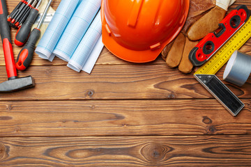 Assorted work tools on wooden table