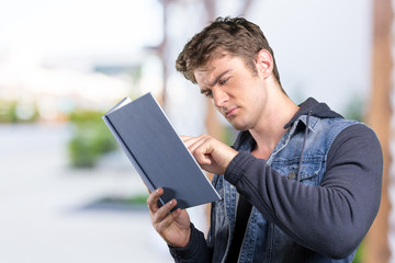 adult man reading book