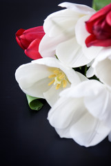 Fototapeta na wymiar Bouquet of tulips on black background