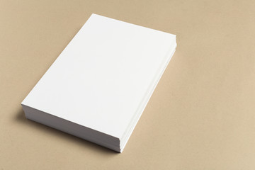 White business card on wooden table. Blank portrait A4.