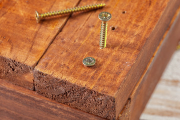 screws on a wooden table