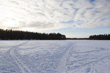 Fototapeta na wymiar Path for walking and skiing on the lake ice.