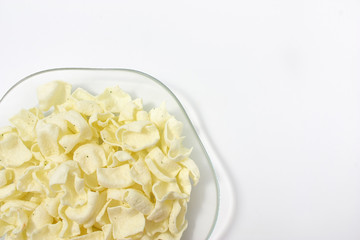 golden potato chips on a white background.