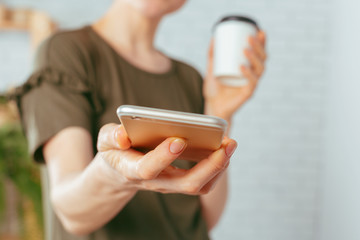 close up of woman texting on smartphone