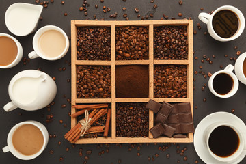 Top view on coffee beans in frame and full cups, background with copy space