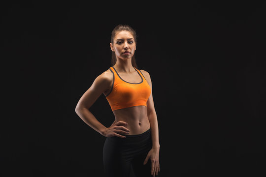 Athletic woman on black background