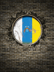 Old Canary islands flag in brick wall