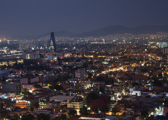 Aerial view of mexico city downtown skyscrappers at sunset time before night.