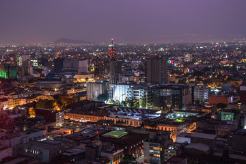 Fototapeta premium Aerial view of mexico city downtown skyscrappers at sunset time before night.